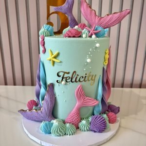 pastel mermaid birthday cake with tails shells and ocean theme by Sweet Story cake studio