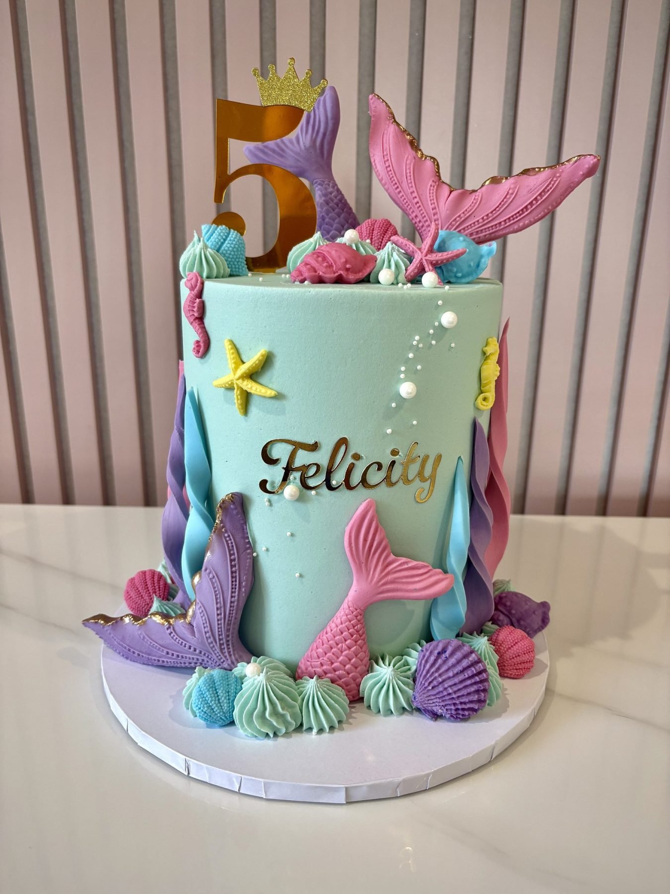 pastel mermaid birthday cake with tails shells and ocean theme by Sweet Story cake studio