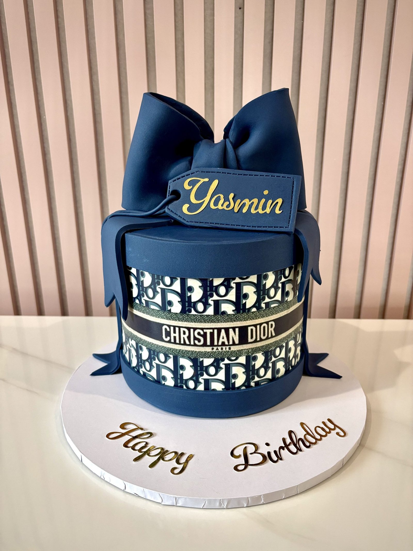luxury blue designer inspired birthday cake with bow and personalised name