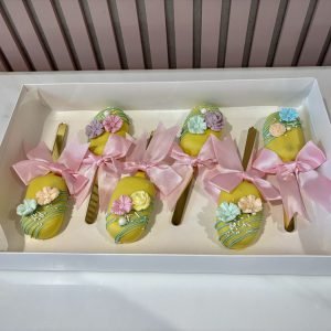 Luxury floral cakesicles with pastel flowers and ribbon presentation by Sweet Story cake studio