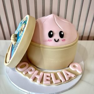 Mystery dumpling birthday cake with fondant dim sum steamer design and cute character inside with personalised name