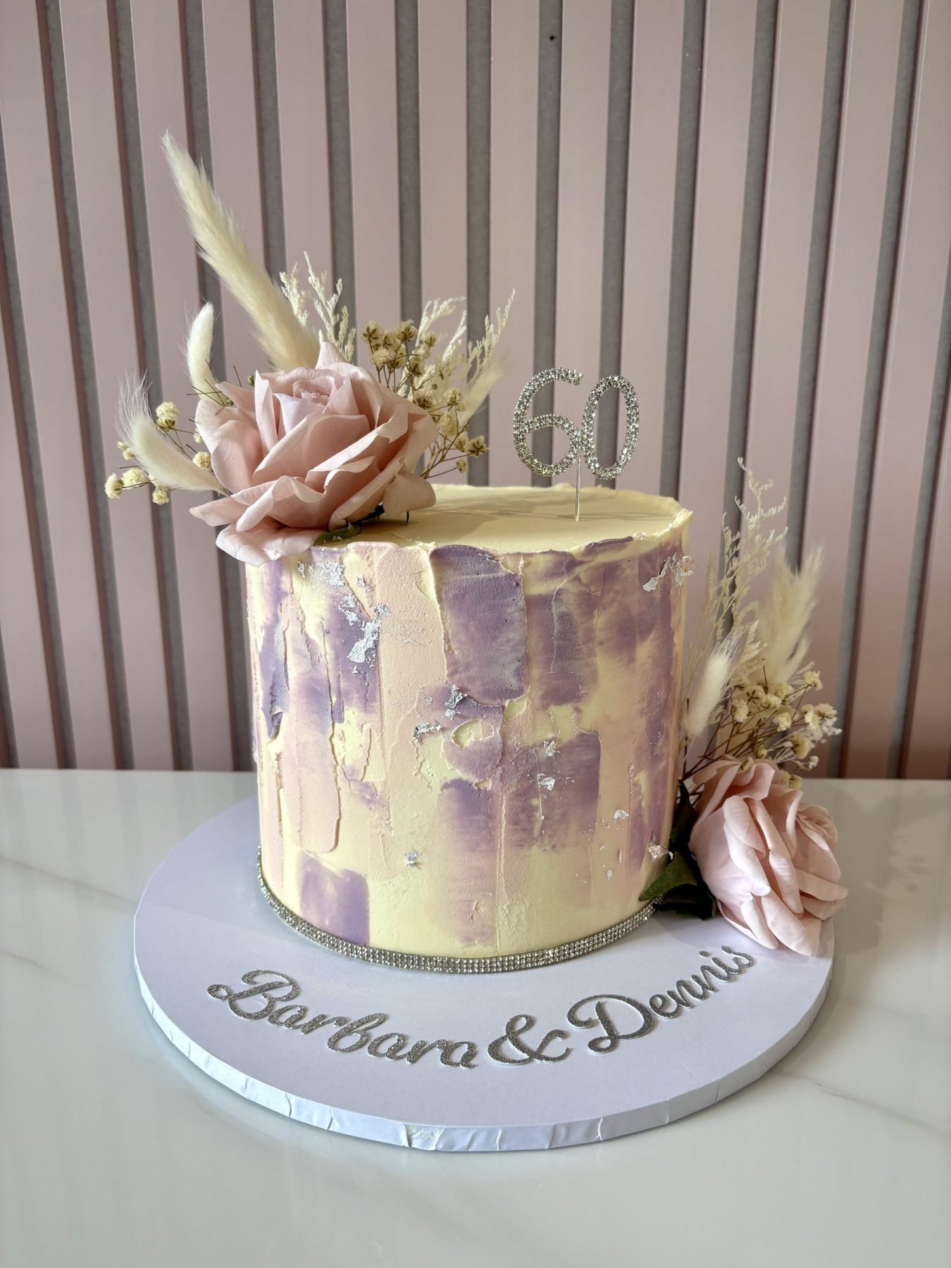 Diamond Wedding Anniversary cake with textured blush and lilac buttercream, silver leaf and floral decorations