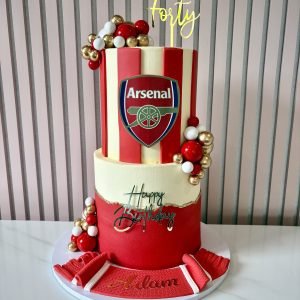 Two tier football themed birthday cake with buttercream finish customised for any team with name detail