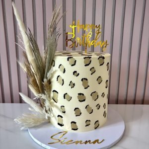 Leopard print birthday cake with buttercream finish and hand painted gold and black detailing