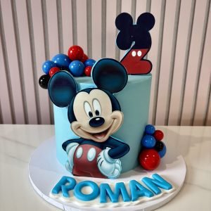 Mickey Mouse themed cake with colourful balloon decorations and customisable age and name details.