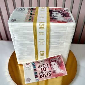Money stack birthday cake with printed edible bank note details and gold money band design