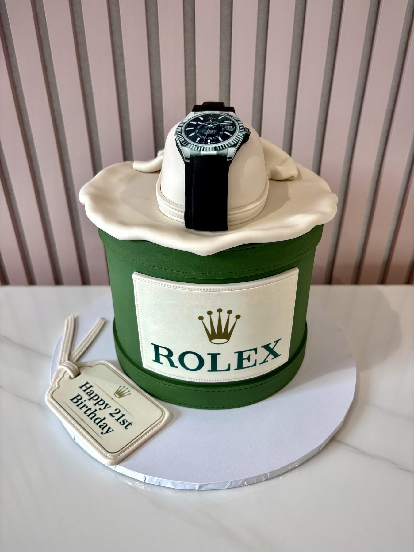Luxury Rolex-inspired cake designed as a Rolex presentation box with detailed watch decoration.